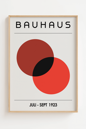 Bauhaus plakat med to overlappende cirkler i dyb rød og sort i minimalistisk geometrisk design.