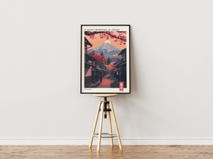 Japansk landskab plakat med Mount Fuji, kirsebærtræer og traditionel japansk gade ved solopgang.