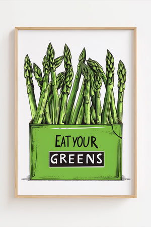 Køkkenplakat med grønne asparges og teksten "Eat Your Greens" i en træramme – sjov og farverig vægdekoration til køkkenet.