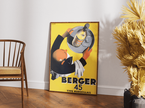 Vintage Banania plakat med smilende mand og ske – fransk retroreklame i gule og røde farver med teksten "Petit Déjeuner Familial".