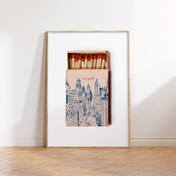 Plakat med New York tændstikæske i retro stil og illustration af storbyens skyline.

